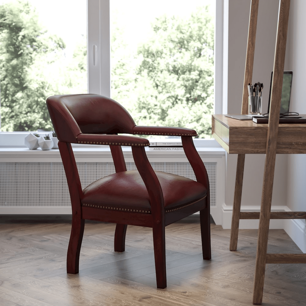 Oxblood Vinyl Luxurious Conference Chair with Accent Nail Trim - Mervyns